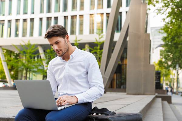 Outdoor businessman with a laptop